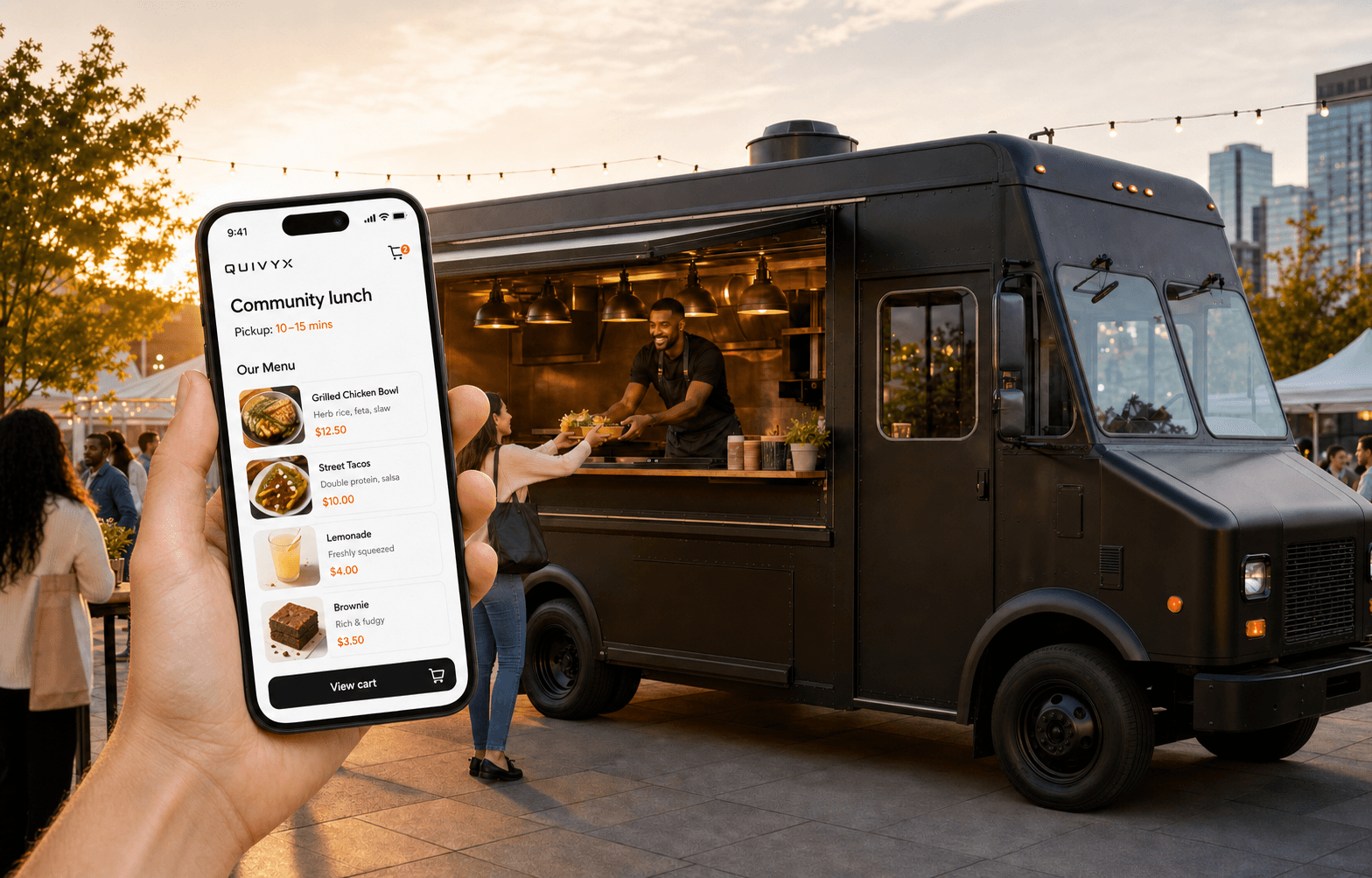 Guest holding an iPhone with the QUIVYX menu beside a modern food truck